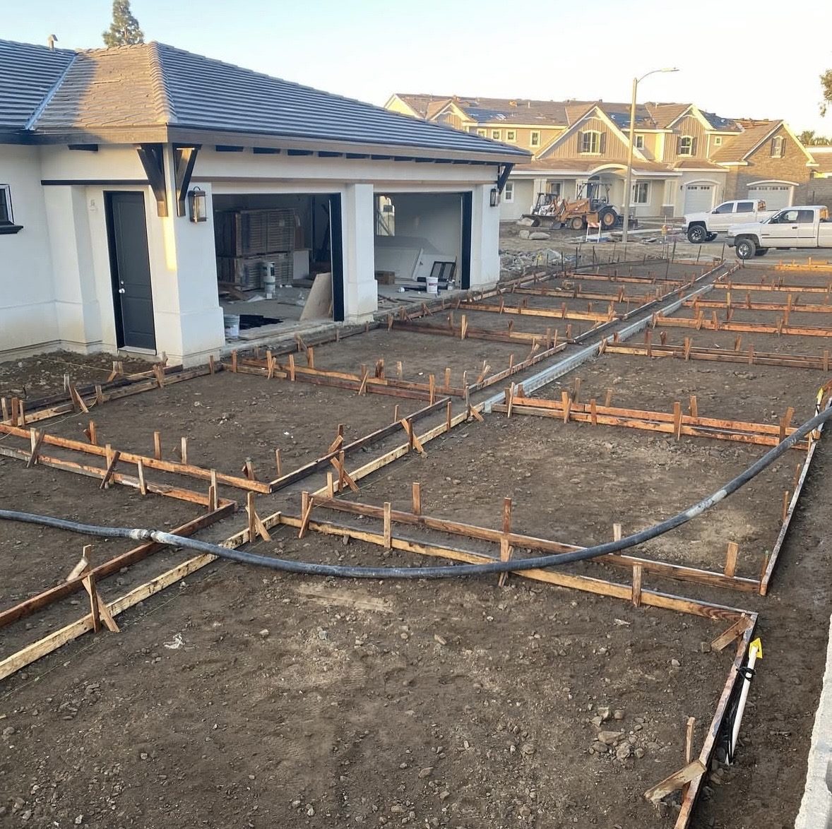 Formwork laid out for a banded driveway on new construction